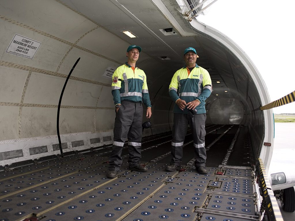 Freight hold of a cargo aircraft being loaded before departure